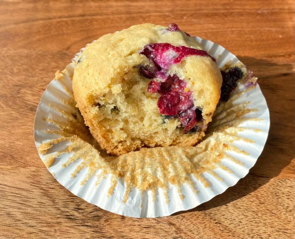 lemon blueberry muffin with bite taken out