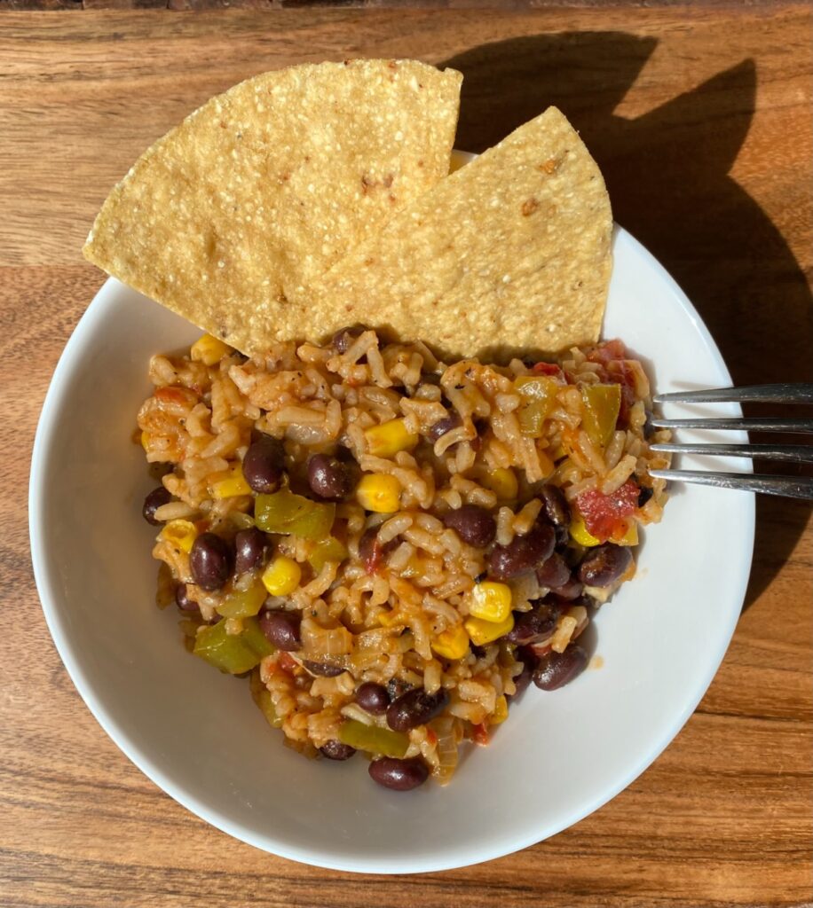 burrito casserole in a bowl with tortilla chips