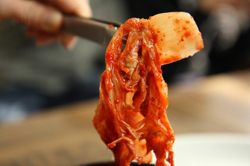 chopsticks with kimchi