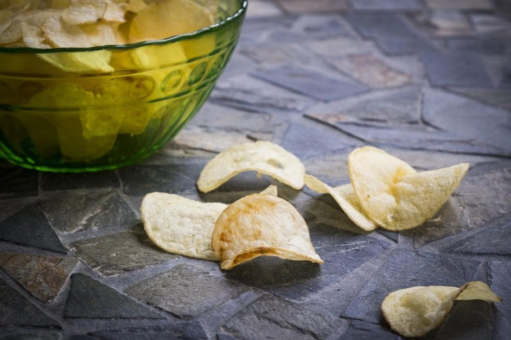 a few potato chips on a table.
