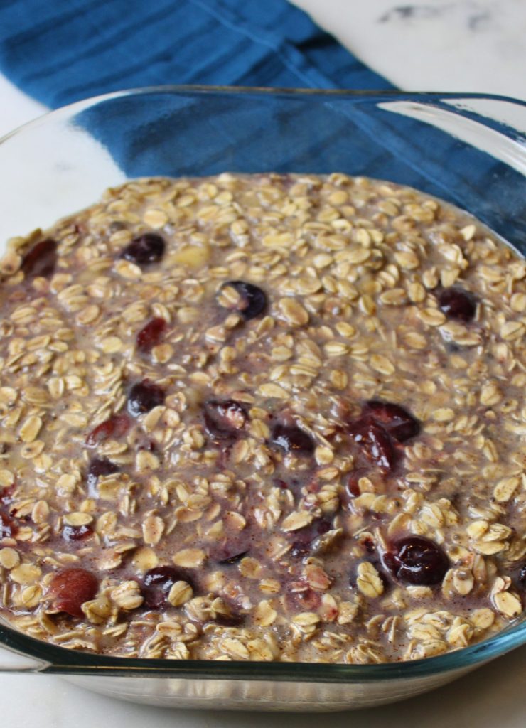 baked oatmeal ingredients mixed in a dish.