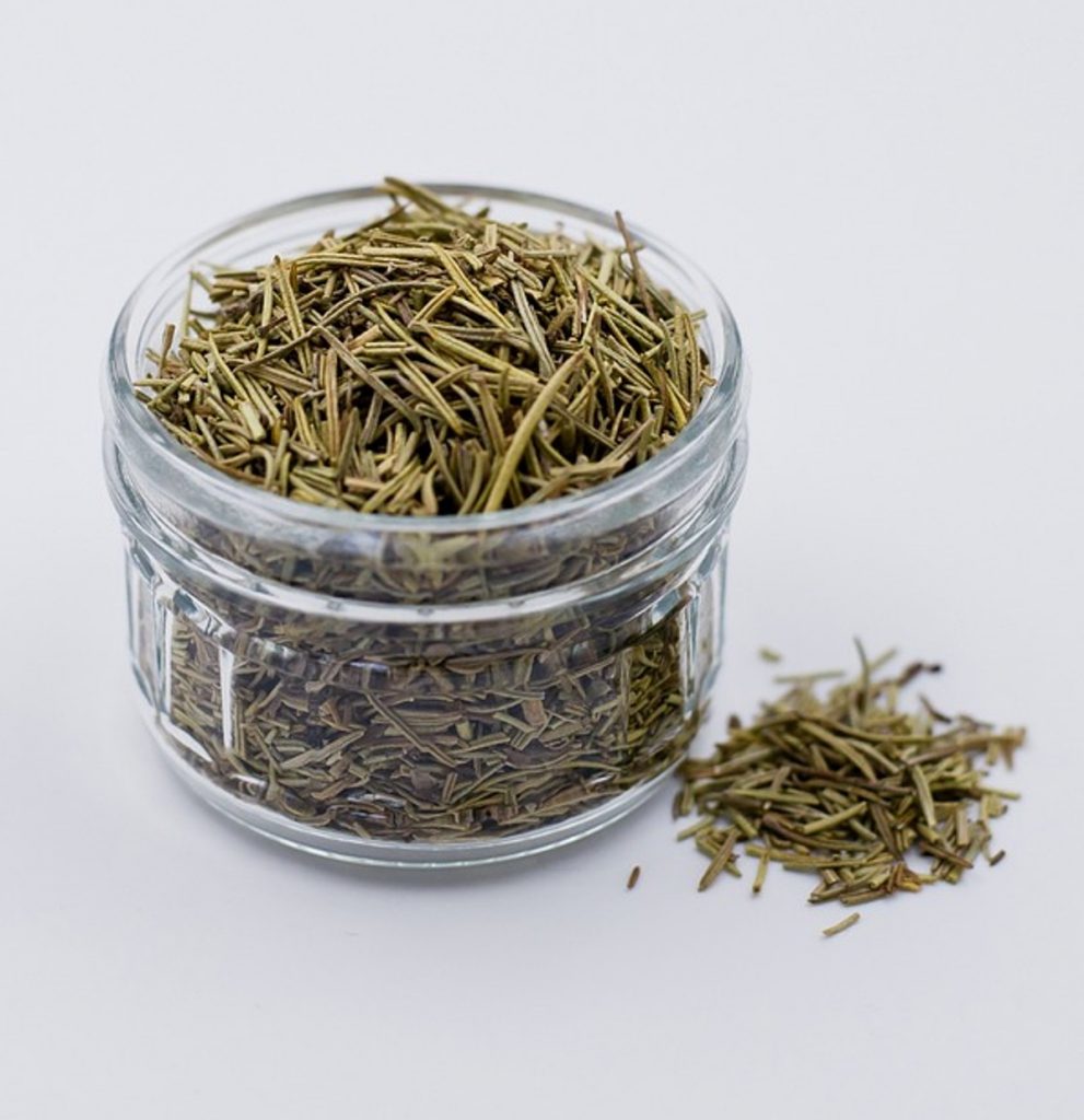 clear jar of dried rosemary.