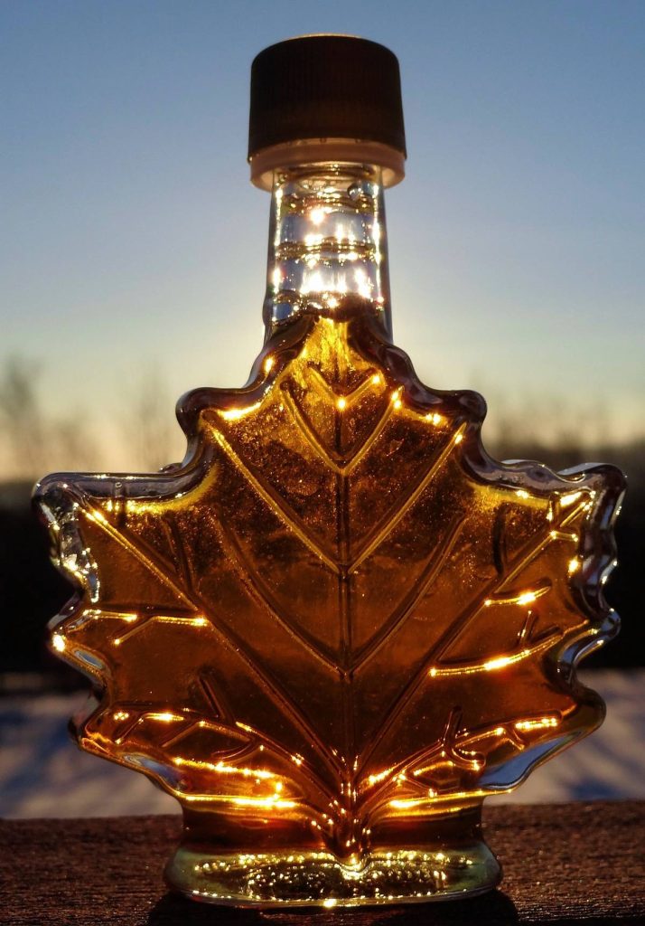 Maple leaf shaped bottle of syrup.
