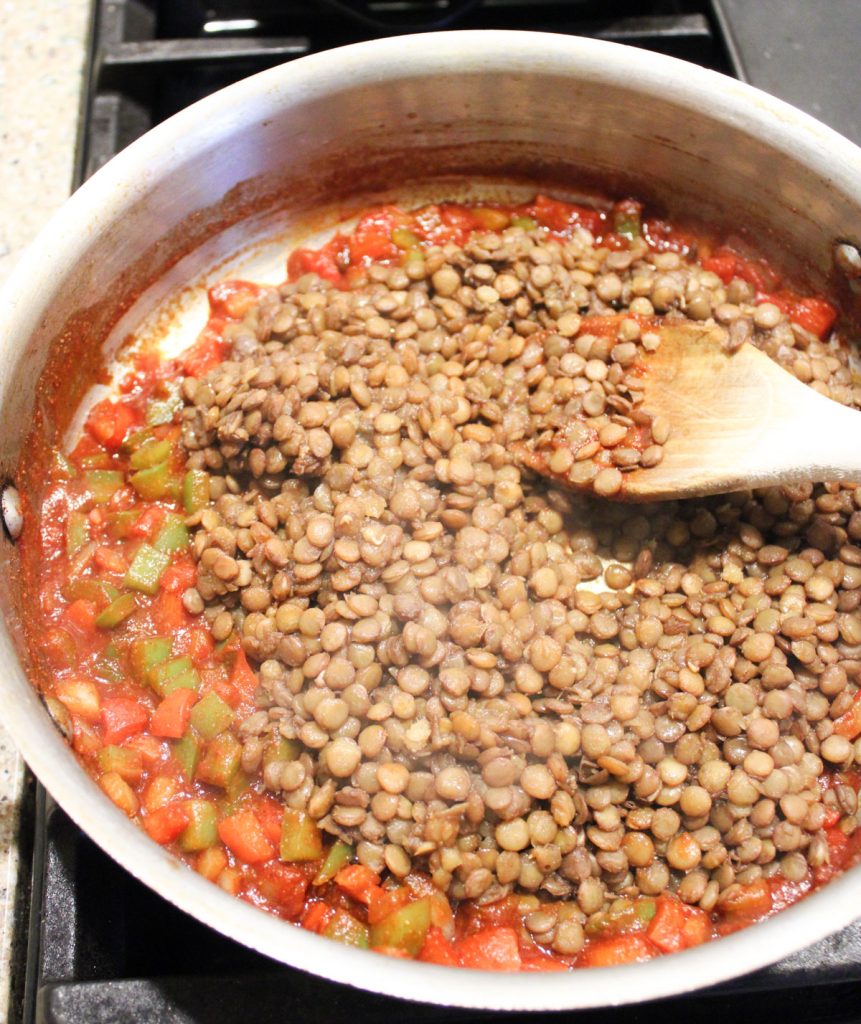 Pot of sauteed veggies with lentils.