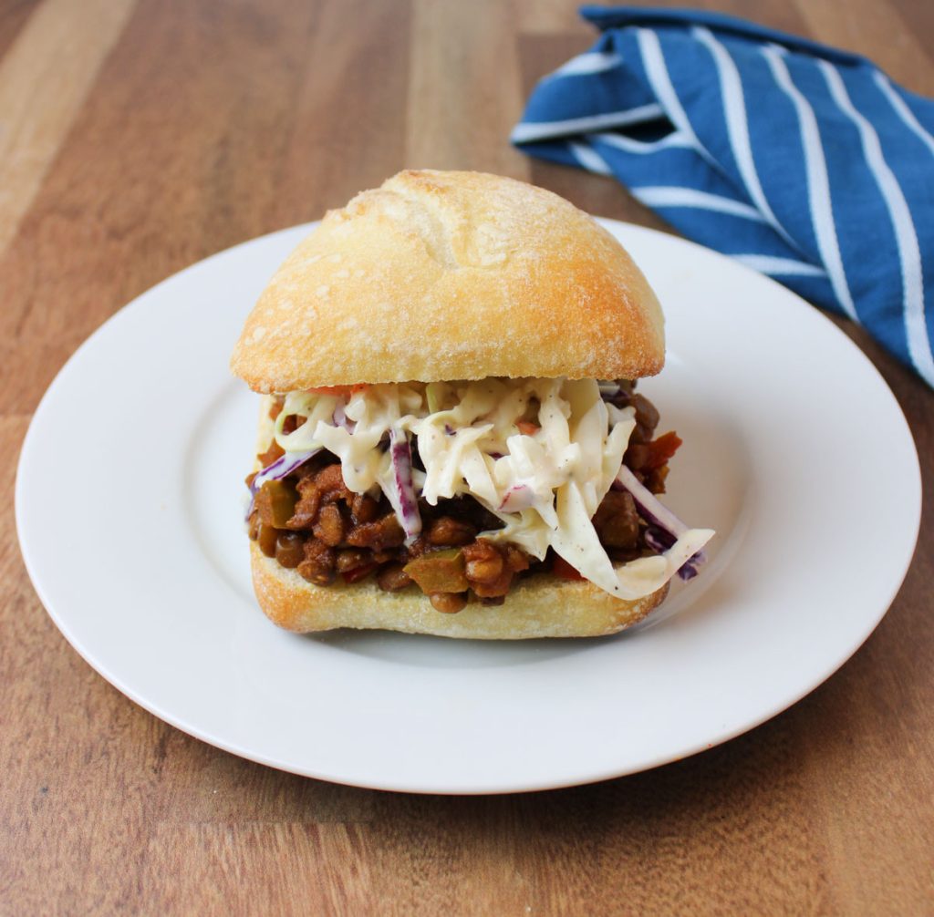Sloppy Joes sandwich with coleslaw on a plate.