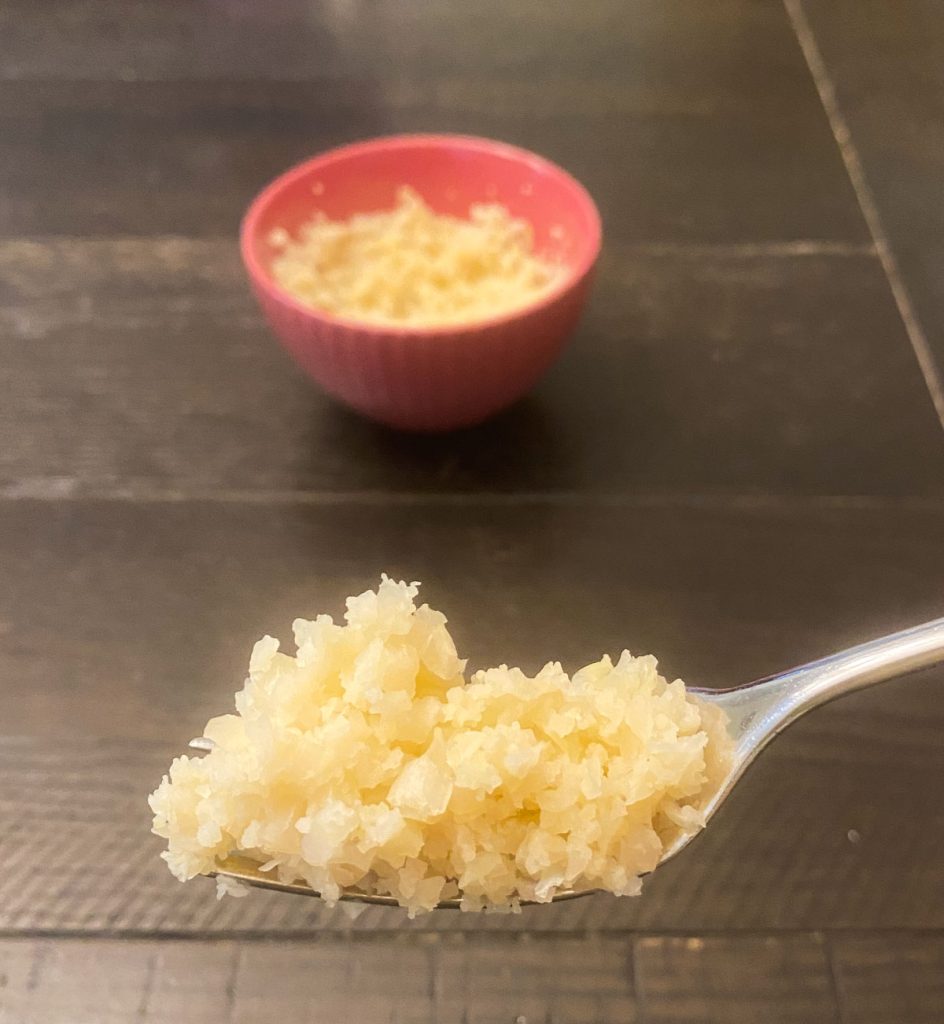 Cauliflower rice on a fork.