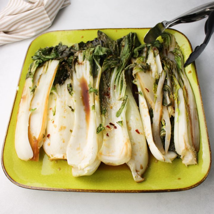 Plate of roasted bok choy.