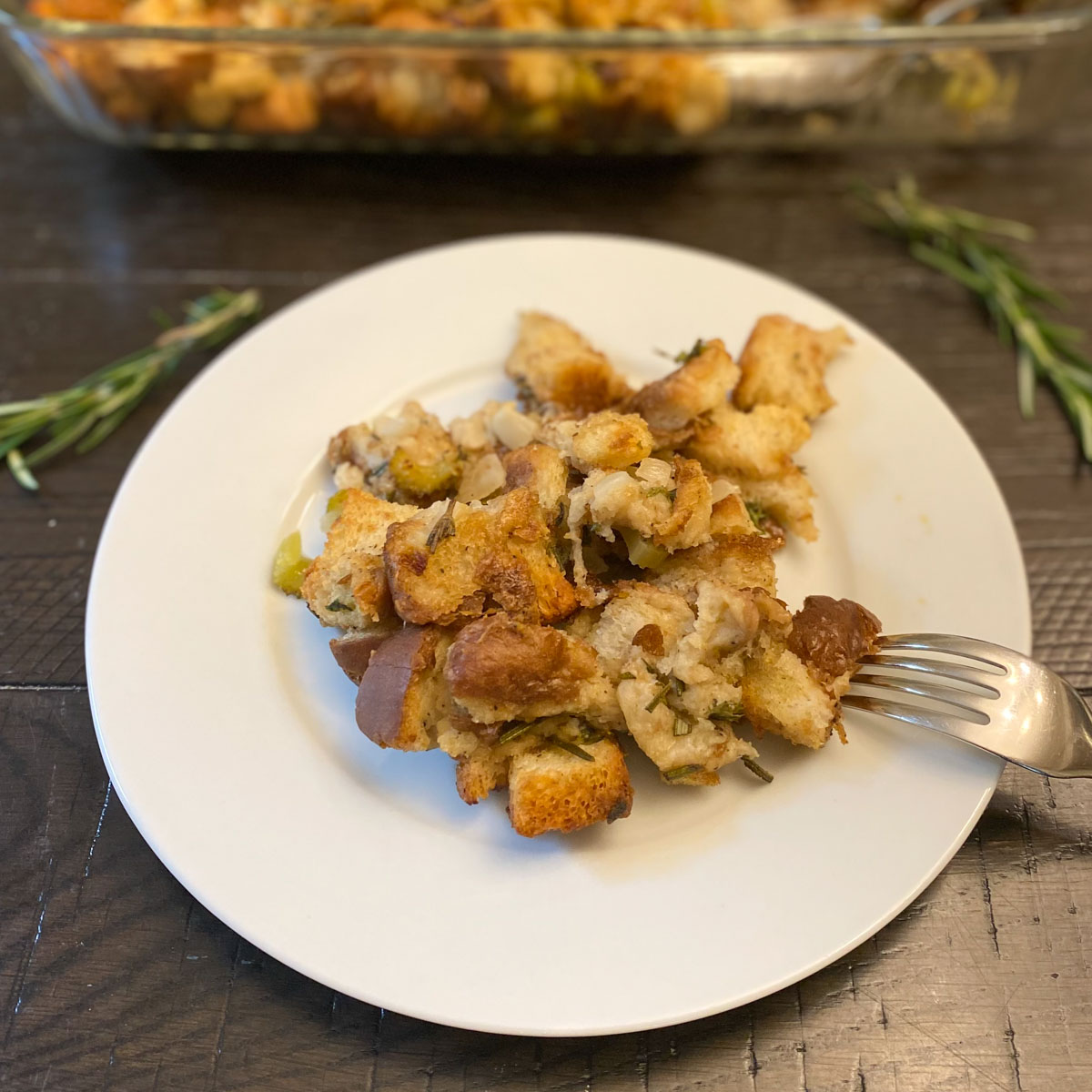 Plate of stuffing on a table.