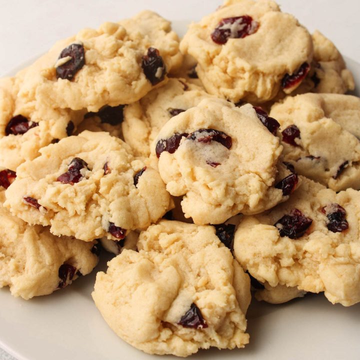 Plate of vegan cranberry cookies with almond extract.
